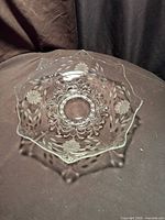 Full view of clear glass centerpiece bowl showing scalloped rim and etched pattern