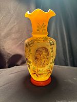 Full view of vase with painted portrait and floral motifs