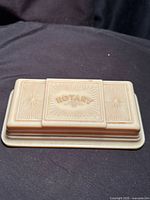 Top view showing ROTARY logo and sunburst design
