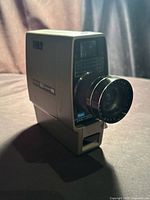 Front three-quarter view of Sears Easi-Load C116 camera showing lens and body
