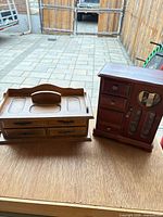 Both mahogany-finish jewelry chests side by side