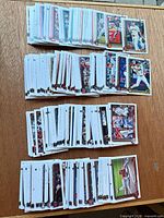 Four stacks of 2025 Topps Series Two baseball cards spread on table