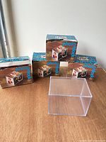 Four boxed photo blocks with one acrylic block displayed