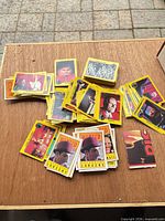 Spread of yellow-border Dick Tracy trading cards on table