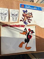 Group shot of all static cling sheets including skulls, Taz sheet, Daffy sheet