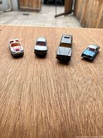 Front view of all four die-cast cars lined up