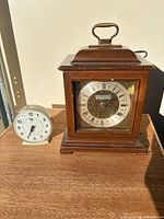 Both clocks side by side on table