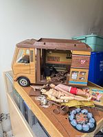 Overall view of camper van, figures, accessories on table