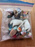 sealed zip bag containing assorted figurines