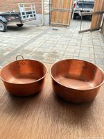 Pair of copper bowls showing size and patina