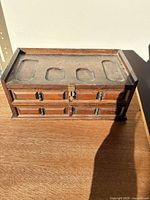 Closed walnut jewelry box front view