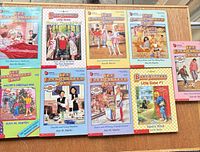 All nine books laid out showing covers