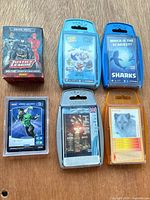 Group shot of demo deck box, sleeved card and four Top Trumps packs