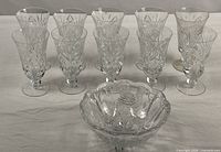 Group view of 10 stemmed glasses and crystal bowl