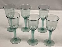Six matching hand-blown aqua wine goblets