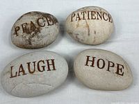 All four etched stones Peace Patience Laugh Hope