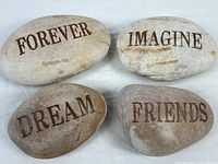 Group shot of all four etched stones