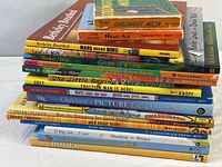 Entire stacked lot of 18 children’s books showing spines