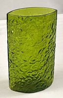 Full view of green textured glass vase showing overall form and texture