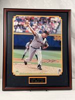 Framed autographed photo with plaque