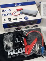 Retail box front showing Halo Bolt ACDC Wireless unit and accessories