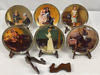 Group shot of six plates on stands plus two loose stands