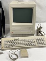 Front view of Macintosh SE SuperDrive with keyboard, mouse and cable
