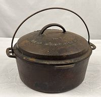 Full view of Dutch oven showing body, lid, bail handle