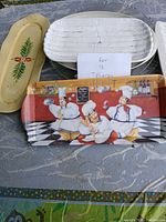 Group of platters showing chef tray, floral platter, ribbed platter, stacked white oval platters