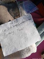 Handwritten note with overview of lot items and portions of scrubber and packaging