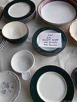 Stacks of plates and bowls showing variety of patterns and sizes