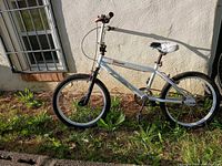 Full side view of white Razor bicycle with 20-inch wheels