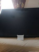 Front view of Sharp TV powered off