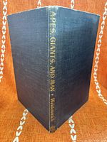 Spine and covers of cloth hardcover showing gilt title and wear