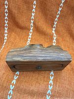 Front view showing natural burl top, wood grain, front clasp