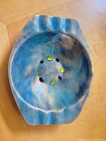 Top view showing blue-turquoise glazed bowl with perforated ring