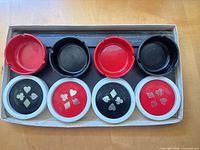 Tray showing ashtrays and coasters with card suit designs