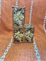 Front view of twin-height porcelain floral holder