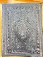 Front cover showing embossed leather design and title