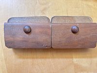 front view of both wood quilt hangers showing knobs and finish