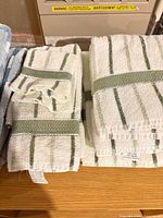 Striped white and green terry towels folded
