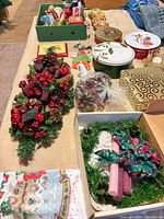 Overview of ornaments, wreath, cookie tins, bow, towel edge