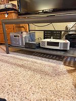 Front lower view showing perforated steel shelf and legs