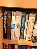 Shelf section with cookbooks including Graham Kerr, International Slim Gourmet, New Diabetic, Martha Stewart Living, Prevention’s The Healthy Cook, Mayo Clinic title, Best Recipes