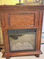 Front view showing mantel detailing and heater insert