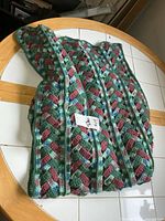 Folded multicolor afghan on table