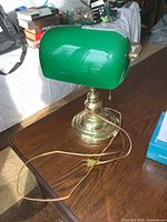 Full view of banker’s lamp showing base, shade and cord
