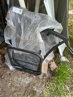 bench frame and mesh panels wrapped in bubble wrap