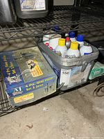 Shelf view with gear puller box and bin of cleaners