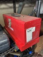 Exterior view of red Craftsman toolbox on shelf